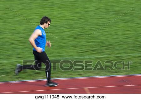 Side profile of a mid adult man running on a sports track View Large Photo Image Stock Photography - Side profile of a mid adult man running on a sports track. Fotosearch