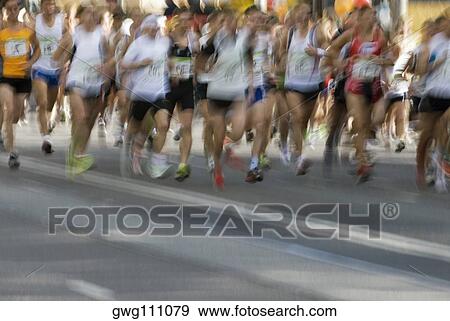Track athletes running on a running track View Large Photo Image Stock Photo - Track athletes running on a running track. Fotosearch
