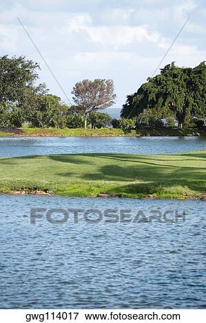 Golf course near a lake View Large Photo Image Stock Photo - Golf course near a lake. Fotosearch