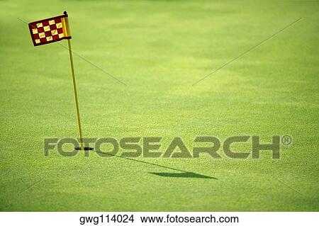 Golf flag in a golf course View Large Photo Image Picture - Golf flag in a golf course. Fotosearch