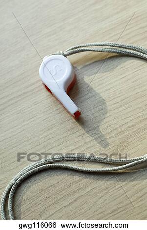 Close-up of a whistle with a cord View Large Photo Image Stock Photograph - Close-up of a whistle with a cord. Fotosearch