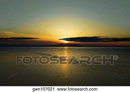 Stock Image - Sunset over an island, Fire Island, Anchorage, Alaska, USA. Fotosearch