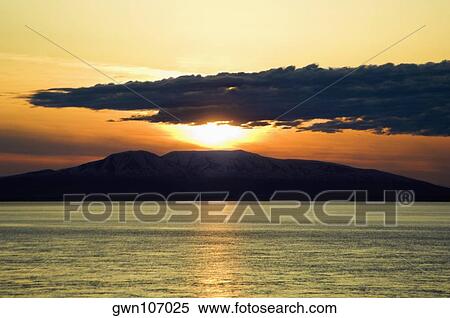 Stock Photography - Sunset over an island, Fire Island, Alaska, USA. Fotosearch