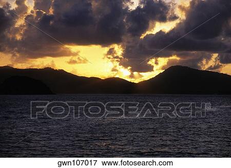 Stock Photo - Sunset over an island, Phi Phi Islands, Andaman Sea, Thailand. Fotosearch