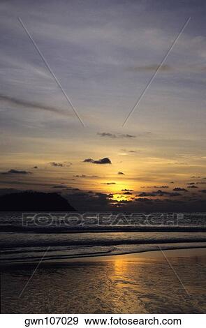 Sunset over an island, Phi Phi Islands, Andaman Sea, Thailand View Large Photo Image Stock Photo - Sunset over an island, Phi Phi Islands, Andaman Sea, Thailand. Fotosearch