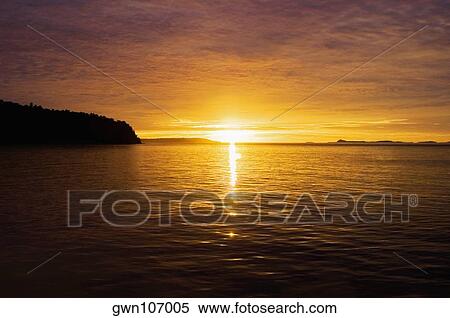 Sunset over the sea, Bangka Island, Sulawesi, Indonesia View Large Photo Image Stock Photography - Sunset over the sea, Bangka Island, Sulawesi, Indonesia. Fotosearch
