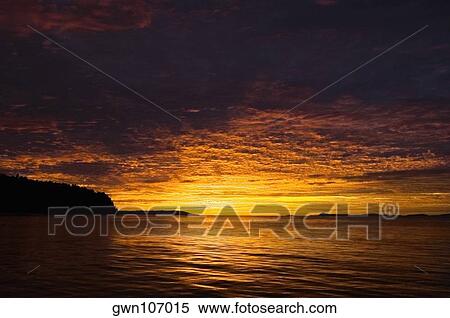 Sunset over the sea, Bangka Island, Sulawesi, Indonesia View Large Photo Image Stock Photography - Sunset over the sea, Bangka Island, Sulawesi, Indonesia. Fotosearch