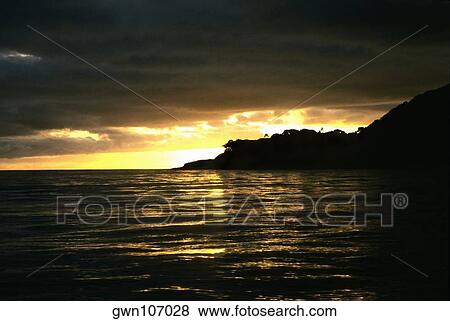Stock Photo - Sunset over the sea, Koro Island, Fiji. Fotosearch
