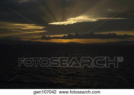 Sunset over the sea, Milne Bay, Papua New Guinea View Large Photo Image Stock Image - Sunset over the sea, Milne Bay, Papua New Guinea. Fotosearch