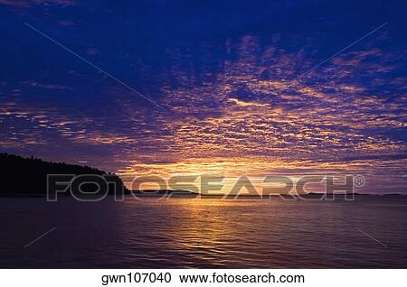 Stock Image - Sunset over the sea, Sulawesi, Indonesia. Fotosearch