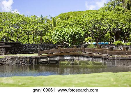 Bridge across a river, Liliuokalani Park and Gardens, Hilo, Big Island, Hawaii Islands, USA View Large Photo Image Stock Image - Bridge across a river, Liliuokalani Park and Gardens, Hilo, Big Island, Hawaii Islands, USA. Fotosearch