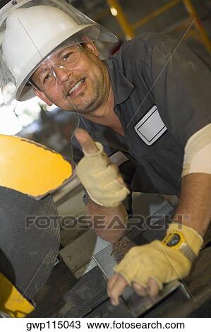 Stock Image - Portrait of a mature man showing a thumbs up sign. Fotosearch