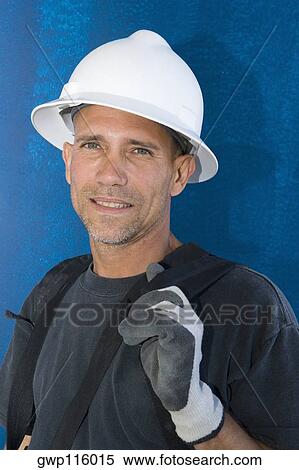 Stock Photography - Close-up of a male construction worker smiling. Fotosearch