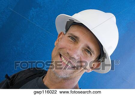 Stock Image - Portrait of a male construction worker smiling. Fotosearch