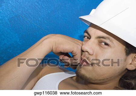 Portrait of a male construction worker thinking View Large Photo Image Stock Photo - Portrait of a male construction worker thinking. Fotosearch