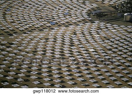 Field of solar-power 10 megawatt heliostat mirrors, Daggett, California View Large Photo Image Stock Image - Field of solar-power 10 megawatt heliostat mirrors, Daggett, California. Fotosearch
