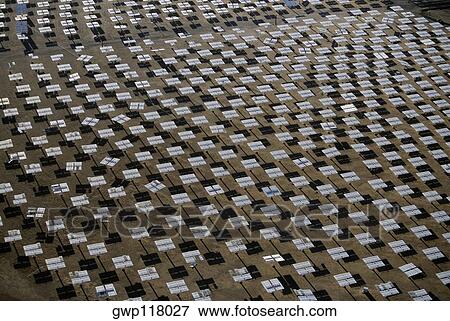 Field of solar-power 10 megawatt heliostat mirrors, Daggett, California View Large Photo Image Stock Photo - Field of solar-power 10 megawatt heliostat mirrors, Daggett, California. Fotosearch
