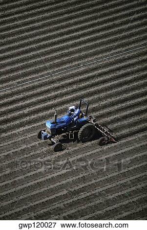 Aerial of field being plowed View Large Photo Image Stock Photo - Aerial of field being plowed. Fotosearch