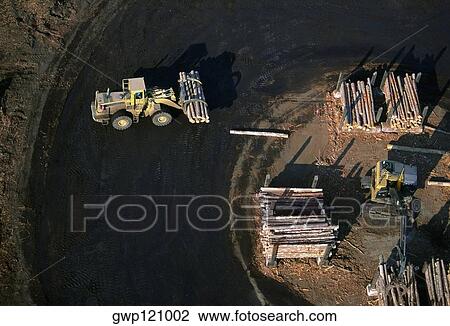 Sawmill log handler at work, Idaho View Large Photo Image Stock Image - Sawmill log handler at work, Idaho. Fotosearch