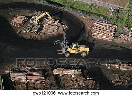 Sawmill log handler at work, Idaho View Large Photo Image Stock Photograph - Sawmill log handler at work, Idaho. Fotosearch