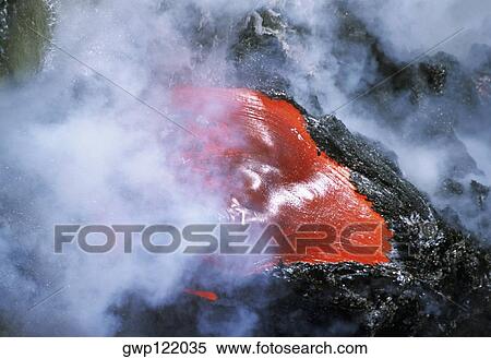 Steam rises from lava flowing into the sea, Hawaii View Large Photo Image Stock Photography - Steam rises from lava flowing into the sea, Hawaii. Fotosearch