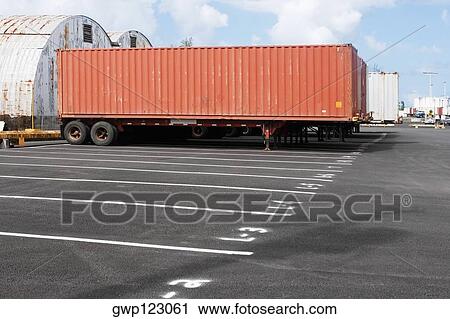 Cargo container on the lane at a commercial dock View Large Photo Image Stock Image - Cargo container on the lane at a commercial dock. Fotosearch