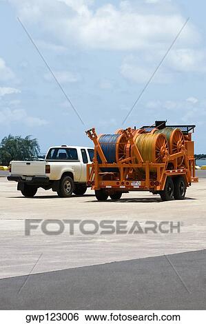 Crane and a car at a commercial dock View Large Photo Image Stock Photograph - Crane and a car at a commercial dock. Fotosearch