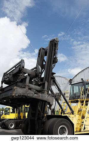 Forklifts at a commercial dock View Large Photo Image Picture - Forklifts at a commercial dock. Fotosearch
