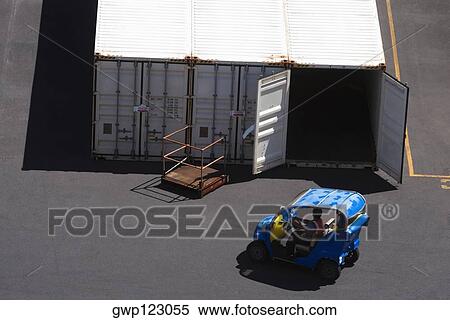 High angle view of a car in front of cargo containers at a commercial dock View Large Photo Image Stock Photography - High angle view of a car in front of cargo containers at a commercial dock. Fotosearch