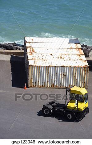High angle view of a forklift and cargo containers at a commercial dock View Large Photo Image Stock Photograph - High angle view of a forklift and cargo containers at a commercial dock. Fotosearch