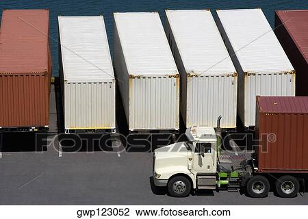 High angle view of a semi-truck with cargo containers at a commercial dock View Large Photo Image Stock Image - High angle view of a semi-truck with cargo containers at a commercial dock. Fotosearch