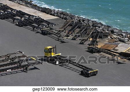 High angle view of a semi-truck with vehicle trailers at a commercial dock View Large Photo Image Stock Photo - High angle view of a semi-truck with vehicle trailers at a commercial dock. Fotosearch