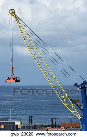 High angle view of cargo containers and a crane at a commercial dock View Large Photo Image Stock Image - High angle view of cargo containers and a crane at a commercial dock. Fotosearch