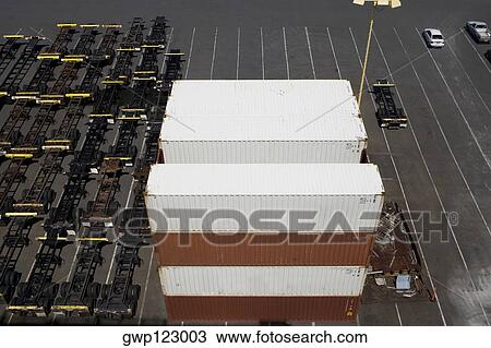 Stock Image - High angle view of cargo containers at a commercial dock. Fotosearch