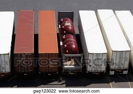 Stock Image - High angle view of cargo containers at a commercial dock. Fotosearch