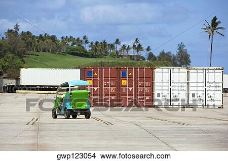 Worker driving a car at a commercial dock View Large Photo Image Picture - Worker driving a car at a commercial dock. Fotosearch