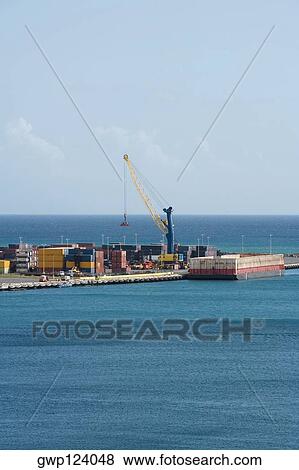 Stock Photo - Cargo containers at a commercial dock. Fotosearch