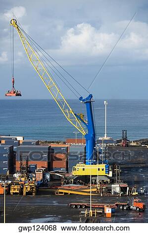 Stock Photo - High angle view of a crane and cargo containers at a harbor, Honolulu Harbor, Honolulu, Oahu, Hawaii Islands, USA. Fotosearch