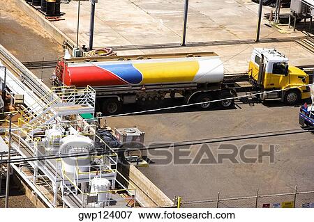 High angle view of a semi-truck and storage tanks at an oil refinery, Nawiliwili Beach Park, Kauai, Hawaii Islands, USA View Large Photo Image Stock Photo - High angle view of a semi-truck and storage tanks at an oil refinery, Nawiliwili Beach Park, Kauai, Hawaii Islands, USA. Fotosearch