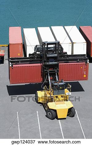 High angle view of a vehicle trailer loaded with cargo containers at a commercial dock, Hawaii Islands, USA View Large Photo Image Stock Photo - High angle view of a vehicle trailer loaded with cargo containers at a commercial dock, Hawaii Islands, USA. Fotosearch
