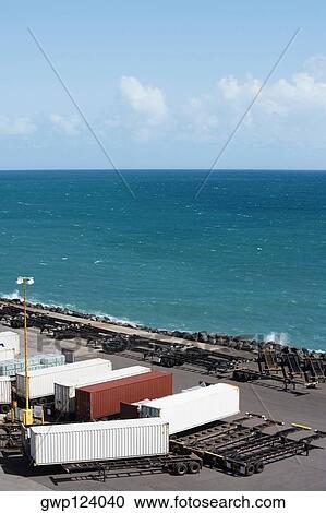Stock Image - High angle view of cargo containers at a commercial dock. Fotosearch