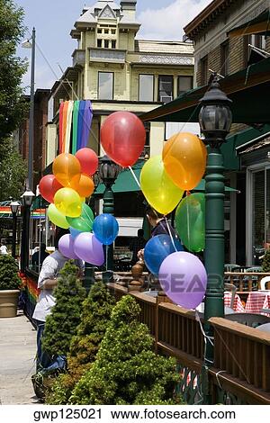 Balloons tied up on lampposts in a sidewalk cafe, Dupont Circle, Washington DC, USA View Large Photo Image Stock Image - Balloons tied up on lampposts in a sidewalk cafe, Dupont Circle, Washington DC, USA. Fotosearch