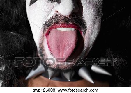 Close-up of a man wearing a spikey pet collar and showing his tongue View Large Photo Image Stock Photo - Close-up of a man wearing a spikey pet collar and showing his tongue. Fotosearch