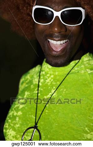 Stock Image - Close-up of a mid adult man smiling. Fotosearch