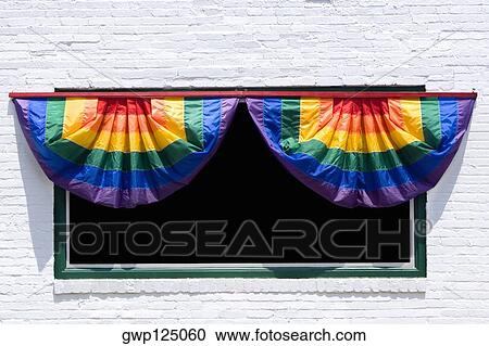 Close-up of a rainbow curtains hanging on a window View Large Photo Image Stock Image - Close-up of a rainbow curtains hanging on a window. Fotosearch
