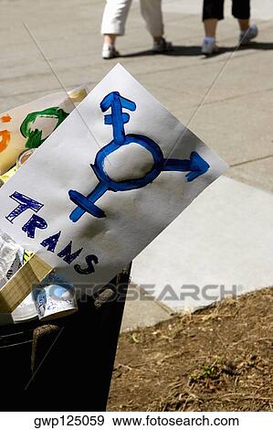 Stock Photo - Close-up of gay pride symbol banners in a garbage can. Fotosearch