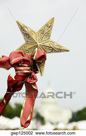 Stock Image - Close-up of star on a staff, Capitol Building, Washington DC, USA. Fotosearch