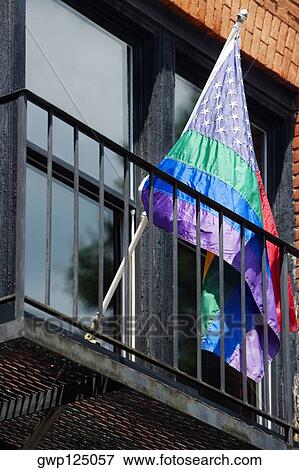 Stock Photo - Low angle view of a flag in a balcony. Fotosearch