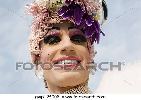Low angle view of a gay man smiling View Large Photo Image Stock Photograph - Low angle view of a gay man smiling. Fotosearch