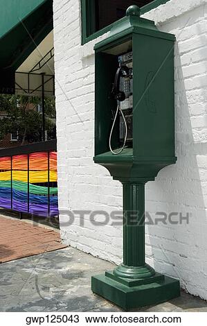Pay phone near a building with the rainbow flag in the background View Large Photo Image Stock Image - Pay phone near a building with the rainbow flag in the background. Fotosearch